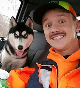 Photo of FIRST driver Mike Howe and Siberian Husky he saved.
